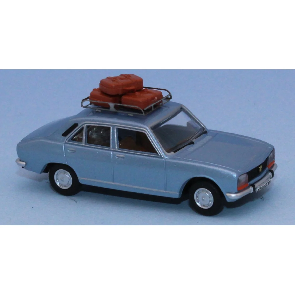 Peugeot 504 car, metallic dawn blue, roof rack and 3 suitcases - SA... Peugeot 504 car, metallic dawn blue, roof rack and 3 suitcases - SA...