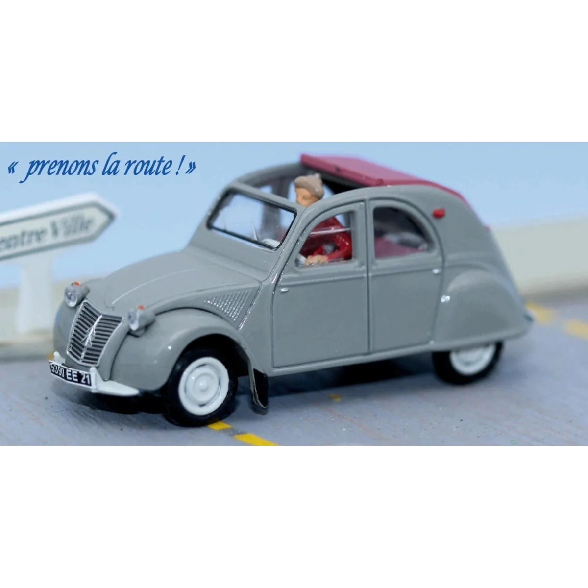 SAI 1605 Grey Citroën 2CV with open red top, with a female driver SAI 1605 Grey Citroën 2CV with open red top, with a female driver